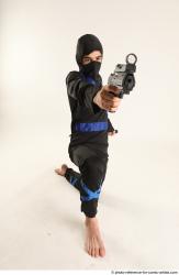 VLASTIMIL KNEELING POSE WITH GUN